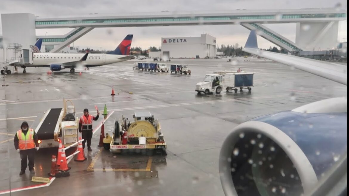 My Flight Experience Orange County To Seattle on Delta First Class - Rainy Window Seat & Flight Meal