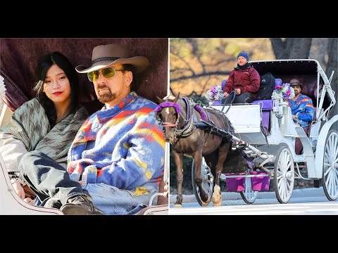 Nicolas Cage takes his new wife Riko Shibata on a romantic carriage ride in New York Nicolas Cage takes his new wife Riko Shibata on a romantic carriage ride in New York