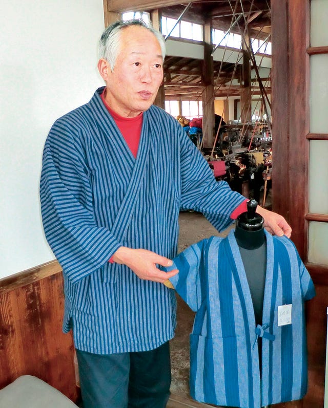 a man holding a bag a man holding a bag