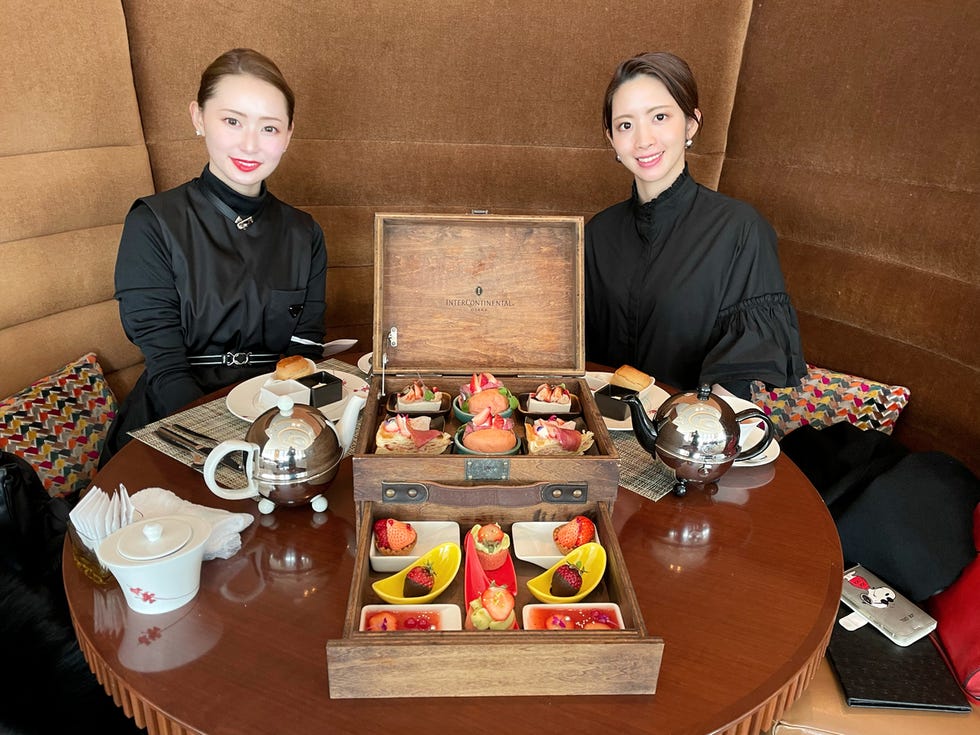 afternoon tea with a variety of desserts served in a wooden box afternoon tea with a variety of desserts served in a wooden box